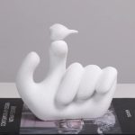 Bird On Hand Sculpture