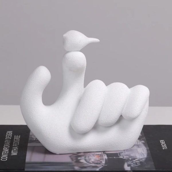 Bird On Hand Sculpture
